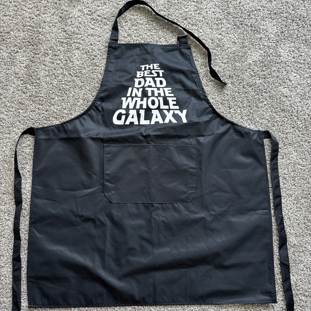 Black Apron with White Text